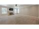 Spacious living room with a fireplace and large windows providing ample light at 2304 Mitford Ct, Dacula, GA 30019