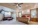 Bright main bedroom with decorative ceiling, large windows, and seating area at 2304 Mitford Ct, Dacula, GA 30019
