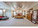 Spacious main bedroom with tray ceilings, sitting area, and decorative wall at 2304 Mitford Ct, Dacula, GA 30019