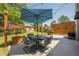 Cozy patio with a table and umbrella and chairs, perfect for outdoor dining and relaxation at 2304 Mitford Ct, Dacula, GA 30019