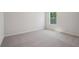 Bedroom with carpet, neutral paint, and a window for natural light at 80 Hampton Ter, Dallas, GA 30157