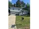 Charming two-story home with a well-maintained lawn and driveway, offering comfortable living at 851 Shore Dr, Lithonia, GA 30058