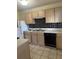 Practical kitchen with tiled floor, ample cabinet space, and modern appliances at 851 Shore Dr, Lithonia, GA 30058