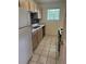 Functional kitchen with stainless steel sink, and tiled floor, great for cooking and meal prep at 851 Shore Dr, Lithonia, GA 30058
