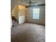 Comfortable living area with carpet, natural light, and stairs to the next level at 851 Shore Dr, Lithonia, GA 30058