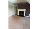 Cozy living room with a fireplace and neutral carpet, perfect for relaxing and entertaining at 851 Shore Dr, Lithonia, GA 30058