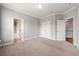 Spacious bedroom with neutral carpet and access to bathroom and stairs, perfect for relaxation and restful nights at 4677 Prater Se Way, Smyrna, GA 30080