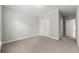 Neutral bedroom features plush carpet, ample closet space, and fresh paint, ready for personalization at 4677 Prater Se Way, Smyrna, GA 30080