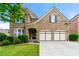 Charming brick home with a well-manicured lawn and a two-car garage at 4677 Prater Se Way, Smyrna, GA 30080