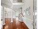 Elegant foyer with hardwood floors, white pillars, and staircase at 4677 Prater Se Way, Smyrna, GA 30080