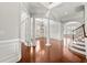 Spacious foyer with hardwood floors, columns, and an open staircase at 4677 Prater Se Way, Smyrna, GA 30080