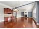 Spacious living room featuring a fireplace, hardwood floors, and a built-in desk area, perfect for both relaxation and work at 4677 Prater Se Way, Smyrna, GA 30080