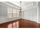 Bright living room with hardwood floors, white trim, and a coffered ceiling at 4677 Prater Se Way, Smyrna, GA 30080