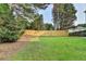Well-maintained backyard with a new wooden fence and mature trees at 4901 Briarleigh Chase Sw, Mableton, GA 30126