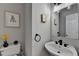 Powder room with a decorative mirror and wall decor at 4901 Briarleigh Chase Sw, Mableton, GA 30126
