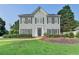 Charming two-story home with symmetrical windows and a well-maintained lawn at 4901 Briarleigh Chase Sw, Mableton, GA 30126
