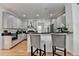 Modern kitchen with gray cabinets, stainless steel appliances, and breakfast bar seating at 4901 Briarleigh Chase Sw, Mableton, GA 30126