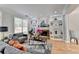 Inviting living room with built-in shelves, fireplace, and hardwood floors at 4901 Briarleigh Chase Sw, Mableton, GA 30126