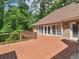 This spacious back deck features views of the lush greenery and is an ideal outdoor retreat at 8443 Marina Bay Ct, Jonesboro, GA 30236