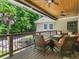 Relaxing back porch with wood ceiling and fireplace offers scenic views at 8443 Marina Bay Ct, Jonesboro, GA 30236