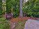 Landscaped backyard with a small bridge and natural surroundings creating a private retreat at 8443 Marina Bay Ct, Jonesboro, GA 30236