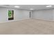 Finished basement featuring neutral carpeting, recessed lighting, and a view of the backyard at 8443 Marina Bay Ct, Jonesboro, GA 30236