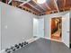 Finished basement featuring gray walls, rubber flooring, storage, and access to other rooms at 8443 Marina Bay Ct, Jonesboro, GA 30236