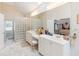 Bright bathroom featuring double vanity, glass block shower, and stylish fixtures at 8443 Marina Bay Ct, Jonesboro, GA 30236