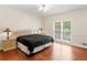 Cozy bedroom with hardwood floors, ample natural light, and neutral paint at 8443 Marina Bay Ct, Jonesboro, GA 30236