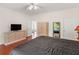 Comfortable bedroom featuring storage cabinets and hardwood floors at 8443 Marina Bay Ct, Jonesboro, GA 30236