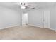 Bedroom with neutral carpet and multiple interior doors at 8443 Marina Bay Ct, Jonesboro, GA 30236