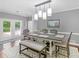 Dining room with modern pendant lighting and access to an outdoor patio at 8443 Marina Bay Ct, Jonesboro, GA 30236