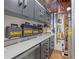 Organized garage features tool storage, work bench, and ample room for projects at 8443 Marina Bay Ct, Jonesboro, GA 30236
