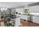 Modern kitchen featuring a large island, stainless appliances, and hardwood floors at 8443 Marina Bay Ct, Jonesboro, GA 30236