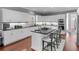 Spacious kitchen with white cabinets, granite countertops and island seating at 8443 Marina Bay Ct, Jonesboro, GA 30236