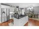 Spacious kitchen with a large island and modern appliances and dining area at 8443 Marina Bay Ct, Jonesboro, GA 30236