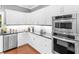 Beautiful kitchen with stainless steel appliances, granite countertops, and custom cabinetry at 8443 Marina Bay Ct, Jonesboro, GA 30236