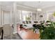 Inviting living room with hardwood floors, stone columns, modern lighting, comfortable seating, and lots of natural light at 8443 Marina Bay Ct, Jonesboro, GA 30236