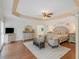 Spacious primary bedroom suite with sitting area, tray ceiling, and ensuite bathroom at 8443 Marina Bay Ct, Jonesboro, GA 30236