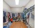 Large walk-in closet offers ample storage space with multiple shelves and rods for clothing and accessories at 8443 Marina Bay Ct, Jonesboro, GA 30236