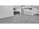Spacious finished basement features durable floors, modern bar with sink, fridge, and microwave at 870 River Cliff Ct, Suwanee, GA 30024