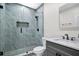 Modern bathroom features a tiled shower, sleek fixtures, and a gray vanity with white countertop at 870 River Cliff Ct, Suwanee, GA 30024