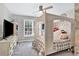 Bedroom with light neutral color pallet, ceiling fan and a four poster bed at 870 River Cliff Ct, Suwanee, GA 30024