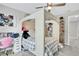 Bedroom with light neutral color pallet, ceiling fan and a four poster bed at 870 River Cliff Ct, Suwanee, GA 30024
