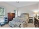 Cozy bedroom with natural light, comfortable bed, hardwood dresser, and neutral decor at 870 River Cliff Ct, Suwanee, GA 30024