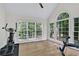 Bright room with exercise equipment and lots of natural light from large windows at 870 River Cliff Ct, Suwanee, GA 30024