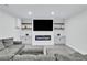 Finished basement living room showcases modern fireplace, plank floors, and comfortable gray seating at 870 River Cliff Ct, Suwanee, GA 30024