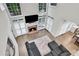 Bright living room with fireplace, hardwood floors, and large windows for natural light at 870 River Cliff Ct, Suwanee, GA 30024