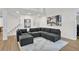 Comfortable living room with modern decor, hardwood floors, and art pieces at 870 River Cliff Ct, Suwanee, GA 30024