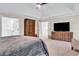 Large main bedroom with tray ceilings and ample closet space near the ensuite bathroom at 870 River Cliff Ct, Suwanee, GA 30024